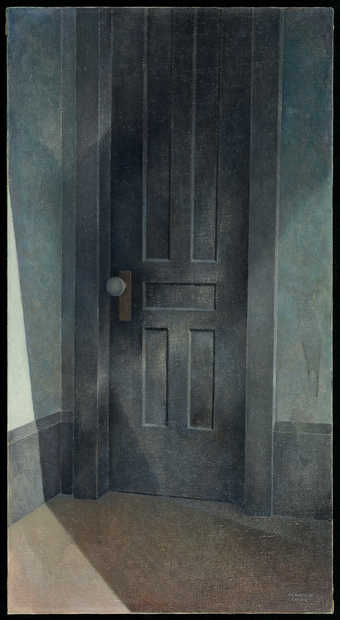 image of a closed wooden, black door