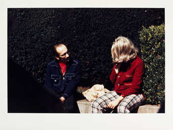 Roberta and unidentified man on bench.