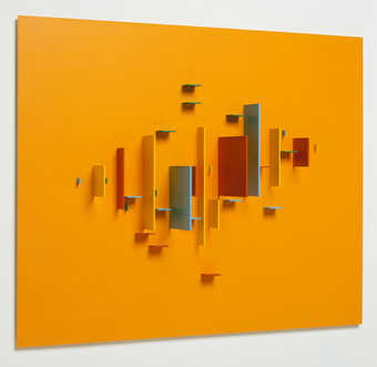colored pieces of aluminum attached to a  orange sheet of aluminum