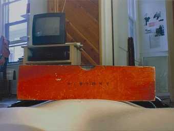 an image of a read history book on a bare abdomen