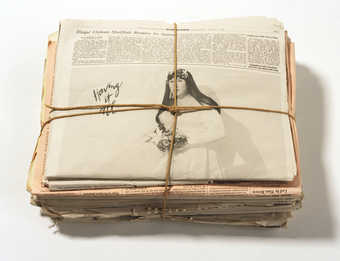 Stack of newspapers printed on Super Fine Mohawk archival paper and bound in twine with image of...