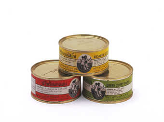 Three cans of curry with three different kinds of curry (red, yellow, and green) with special...