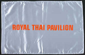 Two flags each with a heat applied appliqué; one flag white satin with orange applied text...