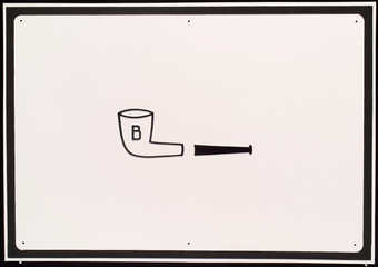 image of pipe in center with "B" painted on bowl