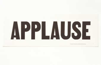 the word "APPLAUSE" in black text