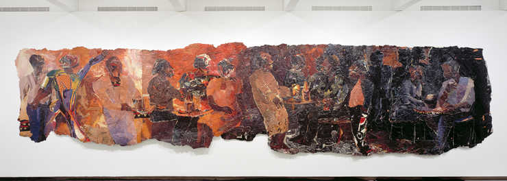 An image of several figures constucted of recycled billboard paper