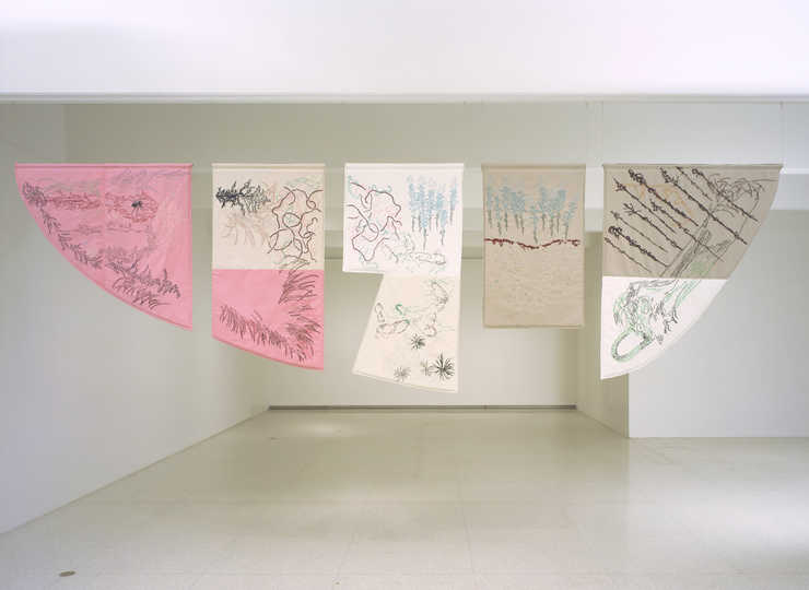 A five part embroidered tapestry, each piece is cut to the shape of a vacant lot is Osaka, Japan