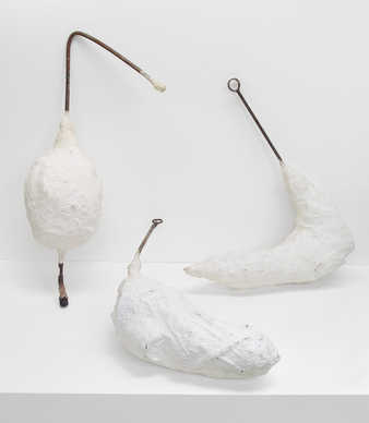 Three white painted epoxy forms pierced with steel rods.  The forms are designed to be carried...