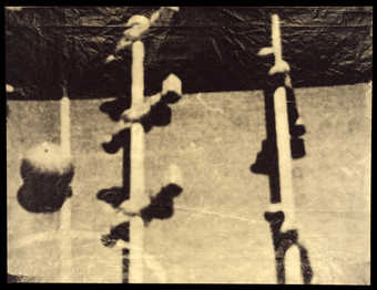 One of four variations of the same image printed in four colors (gray, gold, blue and green) on...