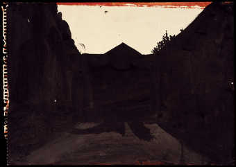 A silohuetted view of a courtyard interior.