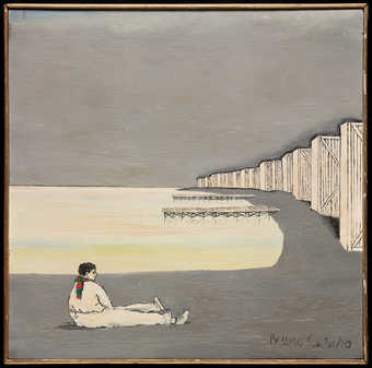 An image of a man lying on a beach.